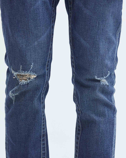 JEANS SLIM FIT DE TIRO MEDIO EN LAVADO OSCURO