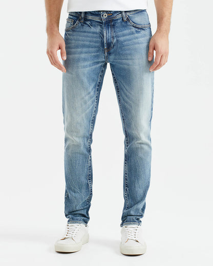 JEANS SLIM FIT DE TIRO MEDIO EN LAVADO MEDIO