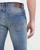 SLIM FIT MID-RISE JEANS IN MEDIUM WASH