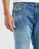 STRAIGHT FIT MID-RISE JEANS IN MEDIUM WASH